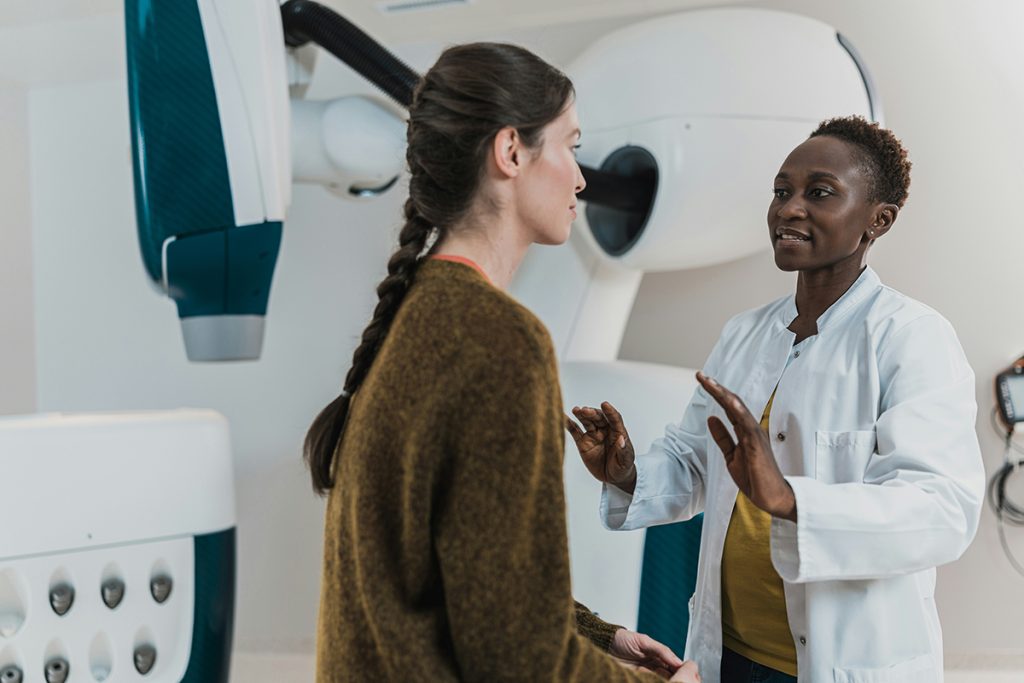 woman speaking to a health professional